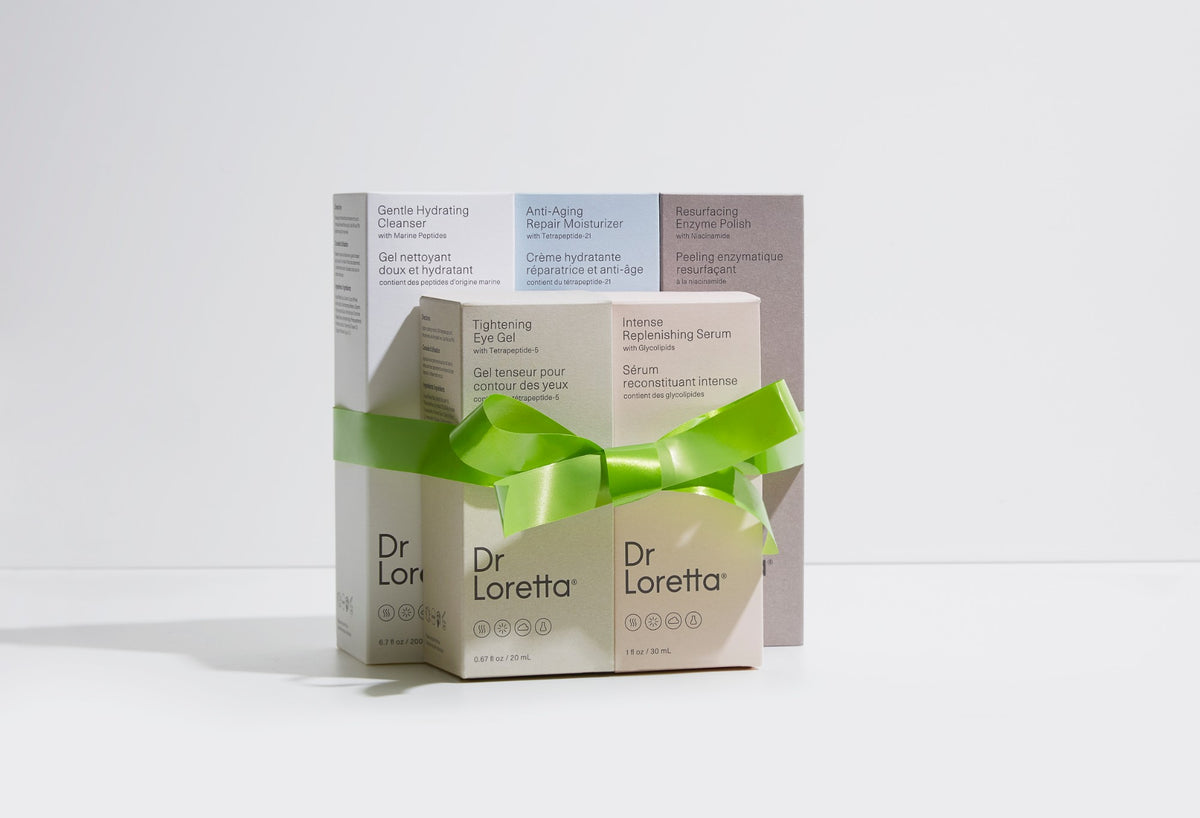 Dr. Loretta gift boxes tied with a green ribbon